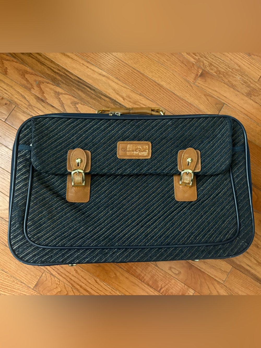 Vintage Oscar de la Renta Travel briefcase in charcoal with tan leather details.